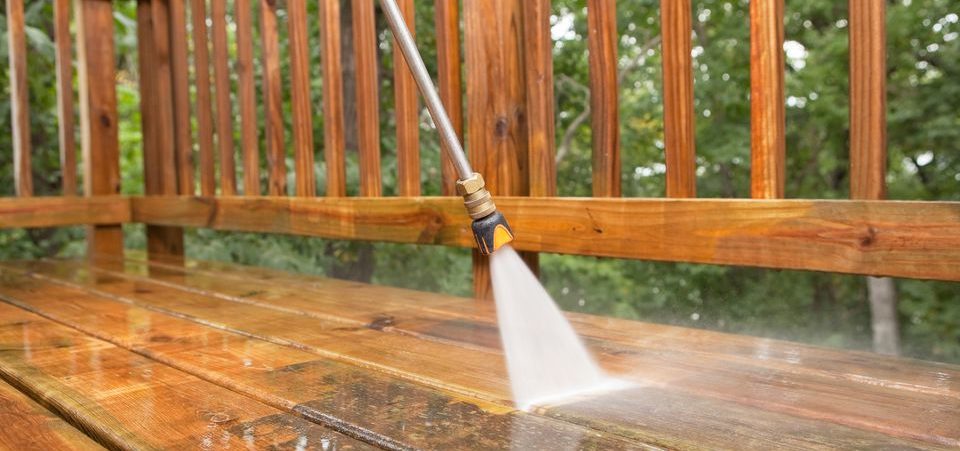 pressure-washer-cleaning-a-weathered-deck-171356261-5810fd5d5f9b58564c69c9c6